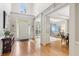 Welcoming foyer with hardwood floors and view into the sitting room at 6795 Preston Glen Dr, Alpharetta, GA 30005