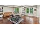 Game room featuring a poker table, a comfortable couch, hardwood flooring, and plenty of natural light at 6795 Preston Glen Dr, Alpharetta, GA 30005