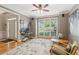 Inviting living room with a large window, hardwood floors, and comfortable seating at 6795 Preston Glen Dr, Alpharetta, GA 30005