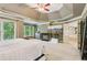 Spacious main bedroom with a fireplace, large windows, and access to a bathroom at 6795 Preston Glen Dr, Alpharetta, GA 30005