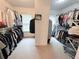 Spacious walk-in closet with ample storage space, shelving and clothing racks for organized living at 6795 Preston Glen Dr, Alpharetta, GA 30005