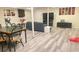 Open basement area with seating, dining space, neutral colors, and resilient vinyl flooring at 3629 Embry Cir, Atlanta, GA 30341
