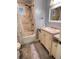 Bathroom featuring a shower/tub combo, toilet, and single sink vanity with storage at 3629 Embry Cir, Atlanta, GA 30341