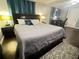 Bright bedroom featuring a cozy bed, nightstands, and a functional desk area at 3629 Embry Cir, Atlanta, GA 30341