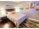 Inviting bedroom with hardwood floors, a cozy bed, and serene wall decor at 3629 Embry Cir, Atlanta, GA 30341
