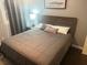 Cozy bedroom with a comfortable-looking bed and a stylish wooden headboard at 3629 Embry Cir, Atlanta, GA 30341