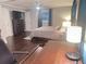 Spacious bedroom with hardwood floors, a ceiling fan, and a comfortable bed and workspace at 3629 Embry Cir, Atlanta, GA 30341