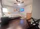 Comfortable bedroom featuring a ceiling fan, wall decor, and a mounted TV at 3629 Embry Cir, Atlanta, GA 30341