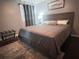 Cozy bedroom with a queen bed, bedside table, and neutral decor for a relaxing ambiance at 3629 Embry Cir, Atlanta, GA 30341
