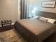 Inviting bedroom showcases a queen bed, stylish nightstand, and decorative pillows for comfort at 3629 Embry Cir, Atlanta, GA 30341
