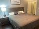 Relaxing bedroom with a large bed, dark wood furniture, and inviting decor at 3629 Embry Cir, Atlanta, GA 30341