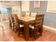 Dining room boasts modern wooden furniture and gleaming hardwood floors at 3629 Embry Cir, Atlanta, GA 30341