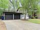 Charming home with a two-car garage, well-maintained lawn, and mature trees at 3629 Embry Cir, Atlanta, GA 30341