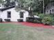 Inviting home exterior with a neat lawn, vibrant shrubbery, and well-placed windows at 3629 Embry Cir, Atlanta, GA 30341