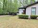 Beautiful home with a well-maintained lawn, complemented by lush greenery and professional landscaping at 3629 Embry Cir, Atlanta, GA 30341