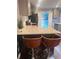 Well-lit kitchen featuring granite countertops, modern appliances, and breakfast bar with stylish seating at 3629 Embry Cir, Atlanta, GA 30341