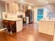 Modern kitchen featuring stainless steel appliances, granite countertops, and hardwood floors at 3629 Embry Cir, Atlanta, GA 30341