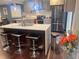Modern kitchen featuring granite countertops, stainless steel appliances, and a functional breakfast bar at 3629 Embry Cir, Atlanta, GA 30341