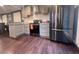 Modern kitchen with stainless steel appliances, plenty of cabinets, and granite countertops provides great space to prepare meals at 3629 Embry Cir, Atlanta, GA 30341