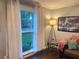 A bright living room with a window, decor, and comfortable seating offers a cozy and inviting atmosphere at 3629 Embry Cir, Atlanta, GA 30341