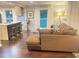 The living room with a brown sectional sofa is adjacent to the kitchen island, offering an open layout at 3629 Embry Cir, Atlanta, GA 30341
