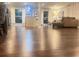 Open floor plan shows the living room's brown sectional sofa and glass coffee table from a low perspective at 3629 Embry Cir, Atlanta, GA 30341