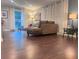 The living room showcases hardwood floors, a brown sectional sofa, and a cozy atmosphere with lots of natural light at 3629 Embry Cir, Atlanta, GA 30341
