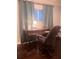 Office space with a wooden desk and a comfortable office chair, perfect for remote work at 3629 Embry Cir, Atlanta, GA 30341