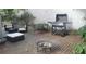 Cozy brick patio with outdoor seating, grill, and fire pit, perfect for entertaining at 3629 Embry Cir, Atlanta, GA 30341