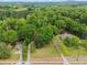 Aerial view of lot surrounded by mature trees offers a great building opportunity at 5766 Macland Rd, Powder Springs, GA 30127