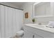 This is a bathroom with a white cabinet sink and a shower-tub area with a patterned shower curtain at 5766 Macland Rd, Powder Springs, GA 30127
