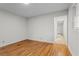 This is a secondary bedroom with hardwood flooring, a window, and a hallway entryway at 5766 Macland Rd, Powder Springs, GA 30127