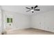 Large bedroom with fan, carpet, and natural light from nearby bath featuring built-ins at 5766 Macland Rd, Powder Springs, GA 30127