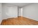 This is a secondary bedroom with hardwood flooring and a closet with white doors at 5766 Macland Rd, Powder Springs, GA 30127