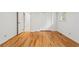 Bright bedroom features hardwood floors, fresh paint, and a double-door closet at 5766 Macland Rd, Powder Springs, GA 30127