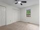 This is a bedroom with carpeted flooring, ceiling fan, closet, and window at 5766 Macland Rd, Powder Springs, GA 30127