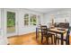 Inviting dining area with hardwood floors and views of the backyard through the windows at 5766 Macland Rd, Powder Springs, GA 30127