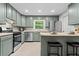 Well-equipped kitchen featuring stainless appliances and a breakfast bar with seating at 5766 Macland Rd, Powder Springs, GA 30127