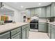 Spacious kitchen featuring stainless steel oven, generous counters, and storage options at 5766 Macland Rd, Powder Springs, GA 30127