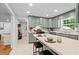 Lovely kitchen featuring breakfast bar, stainless appliances, ample cabinetry, and tile floor at 5766 Macland Rd, Powder Springs, GA 30127