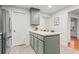 Kitchen with ample cabinetry, island, and access to more rooms of the house at 5766 Macland Rd, Powder Springs, GA 30127