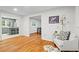 Cozy living room area featuring hardwood floors and access to the kitchen at 5766 Macland Rd, Powder Springs, GA 30127