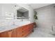 Spa bathroom with gray-tiled shower, double sink vanity, and modern finishes at 639 W Ponce De Leon Ave, Decatur, GA 30030
