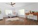 Comfortable bedroom featuring hardwood floors, natural light, and vintage desk at 639 W Ponce De Leon Ave, Decatur, GA 30030