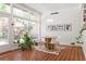 Bright dining area with natural light, a modern light fixture, and access to the outdoors at 639 W Ponce De Leon Ave, Decatur, GA 30030
