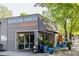 Dancing Goats Coffee Bar, an inviting exterior with sidewalk seating and clear signage on a sunny day at 639 W Ponce De Leon Ave, Decatur, GA 30030