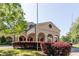 Saint Thomas More Catholic Church featuring classic architecture, arched entrance, and well-maintained landscaping at 639 W Ponce De Leon Ave, Decatur, GA 30030