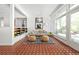 Bright living room featuring large windows, stylish decor, and open layout at 639 W Ponce De Leon Ave, Decatur, GA 30030