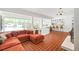 Open concept living room featuring expansive windows, breakfast bar, brick fireplace and spacious seating at 639 W Ponce De Leon Ave, Decatur, GA 30030