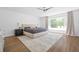 Serene main bedroom with neutral tones, large window, and sleek ceiling fan at 639 W Ponce De Leon Ave, Decatur, GA 30030